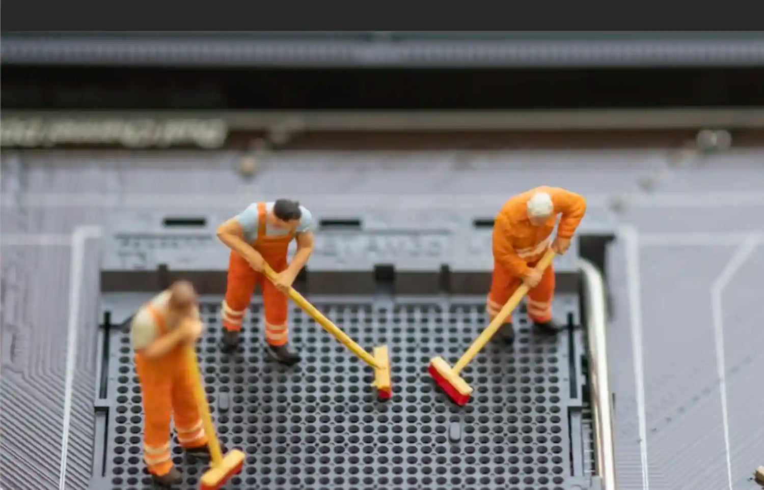 Tiny men cleaning inside a laptop