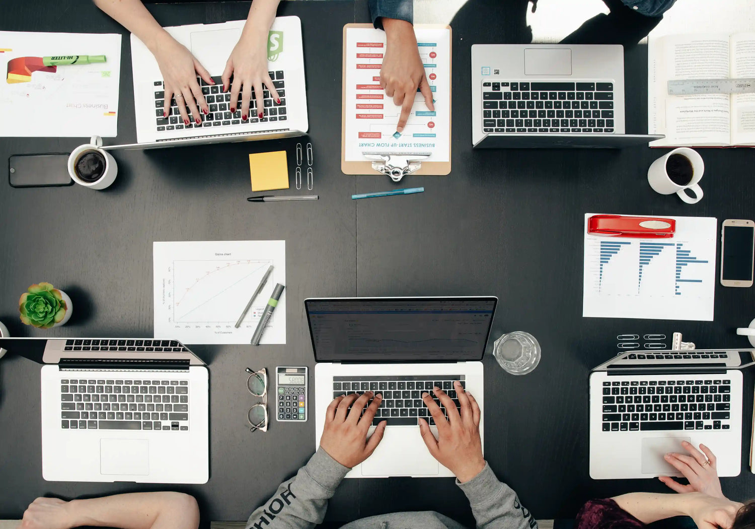 areal view of people working on laptops 